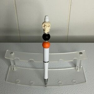Skull Themed Pen with Orange and Black Accents